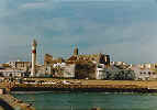 Picture of the light house and an old church in Rota, Spain